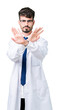 © Krakenimages.com - Young professional scientist man wearing white coat over isolated background Rejection expression crossing arms and palms doing negative sign, angry face