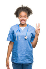 Poster - Young afro american doctor woman over isolated background showing and pointing up with fingers number three while smiling confident and happy.