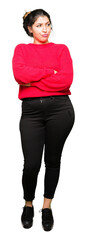 Poster - Young beautiful woman wearing red sweater and bun smiling looking to the side with arms crossed convinced and confident