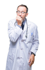 Sticker - Middle age senior hoary doctor man wearing medical uniform isolated background looking stressed and nervous with hands on mouth biting nails. Anxiety problem.