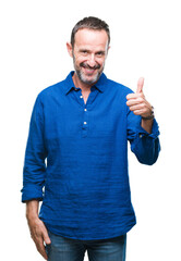 Sticker - Middle age hoary senior man over isolated background doing happy thumbs up gesture with hand. Approving expression looking at the camera with showing success.