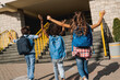 © InsideCreativeHouse - Group of happy multiracial schoolmates elementary middle school kids pupils walking to school together running hurrying to the building for classes lessons. Welcome back to school