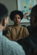 © KC Radler - Diverse group in therapy session, sharing concerns and seeking support in a safe, empathetic atmosphere
