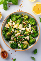 Wall Mural - broccoli and cheese with a spoon on the table