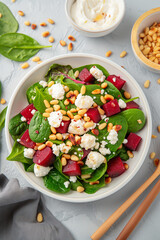 Sticker - A salad with spinach, feta cheese, and nuts