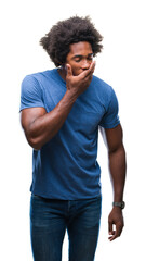 Sticker - Afro american man over isolated background bored yawning tired covering mouth with hand. Restless and sleepiness.