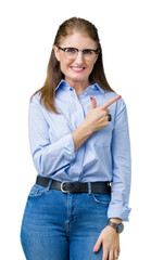 Poster - Beautiful middle age mature business woman wearing glasses over isolated background cheerful with a smile of face pointing with hand and finger up to the side with happy and natural expression on face