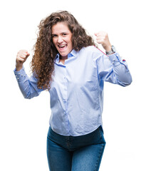 Sticker - Beautiful brunette curly hair young girl wearing elgant look over isolated background very happy and excited doing winner gesture with arms raised, smiling and screaming for success