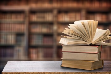 Wall Mural - stack of books in library on wooden table