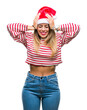 © Krakenimages.com - Young beautiful woman wearing christmas hat over isolated background suffering from headache desperate and stressed because pain and migraine. Hands on head.