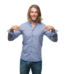 Canvas Print - Young handsome man with long hair over isolated background looking confident with smile on face, pointing oneself with fingers proud and happy.