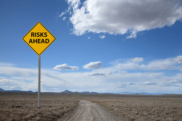 desert road sign risks ahead