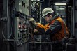 © InfiniteStudio - Electrician in protective gear working on electrical panel in industrial setting, focus, hardwork concept