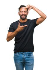 Poster - Adult hispanic man over isolated background smiling making frame with hands and fingers with happy face. Creativity and photography concept.