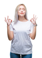 Canvas Print - Young blonde woman over isolated background relax and smiling with eyes closed doing meditation gesture with fingers. Yoga concept.