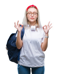 Wall Mural - Young blonde student woman wearing glasses and backpack over isolated background relax and smiling with eyes closed doing meditation gesture with fingers. Yoga concept.