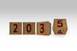 © ShutterFalcon - Happy New Year 2035 graphic. Hand flip 2034 to 2035 block.