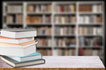 Wall Mural - stack of books in library on wooden table
