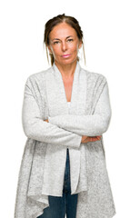 Wall Mural - beautiful middle age adult woman wearing winter sweater over isolated background with serious expres