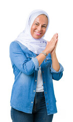 Poster - Middle age eastern arab woman wearing arabian hijab over isolated background Clapping and applauding happy and joyful, smiling proud hands together