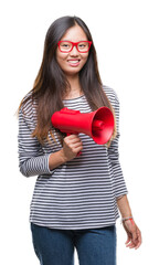 Sticker - Young asian woman holding megaphone over isolated background with a happy face standing and smiling with a confident smile showing teeth