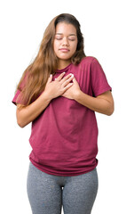 Wall Mural - Young beautiful brunette woman over isolated background smiling with hands on chest with closed eyes and grateful gesture on face. Health concept.