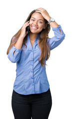 Sticker - Young beautiful brunette business woman talking on smartphone over isolated background stressed with hand on head, shocked with shame and surprise face, angry and frustrated. Fear and upset.