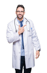 Poster - Handsome young doctor man over isolated background cheerful with a smile of face pointing with hand and finger up to the side with happy and natural expression on face