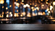 © adynue - Empty black wooden table top with lights bokeh on blur restaurant background