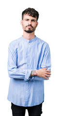 Poster - Young handsome business man over isolated background skeptic and nervous, disapproving expression on face with crossed arms. Negative person.