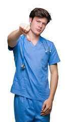 Sticker - Young doctor wearing medical uniform over isolated background looking unhappy and angry showing rejection and negative with thumbs down gesture. Bad expression.