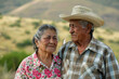 © Mnur - A man and woman are standing in a field, with the man wearing a straw hat