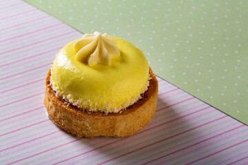 Poster - Cute sweet delicious cupcake on desk on pastel background