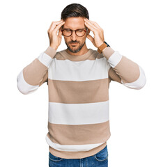 Sticker - Handsome man with beard wearing casual clothes and glasses suffering from headache desperate and stressed because pain and migraine. hands on head.