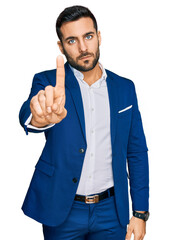 Sticker - Young hispanic man wearing business jacket pointing with finger up and angry expression, showing no gesture