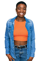 Canvas Print - Young african american woman wearing casual clothes winking looking at the camera with sexy expression, cheerful and happy face.