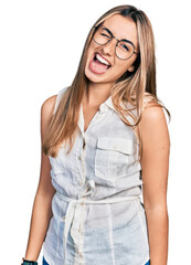 Sticker - Hispanic young woman wearing casual white shirt winking looking at the camera with sexy expression, cheerful and happy face.