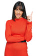 © Krakenimages.com - Young hispanic woman wearing casual clothes smiling happy pointing with hand and finger to the side
