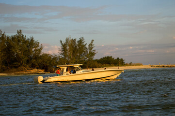 Wall Mural - sunset cruise views from the boat. other boats seen on the horizon as the sun is setting