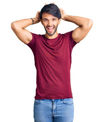 Canvas Print - Handsome hispanic man wearing casual clothes posing funny and crazy with fingers on head as bunny ears, smiling cheerful