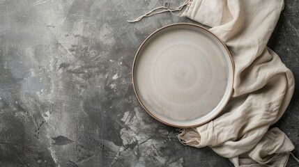 Poster - Empty plate and napkin on gray surface Overhead view