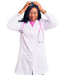 © Krakenimages.com - Young african american woman wearing doctor stethoscope suffering from headache desperate and stressed because pain and migraine. hands on head.