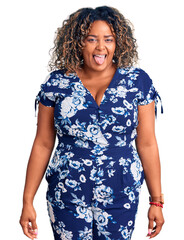 Wall Mural - Young african american plus size woman wearing casual clothes sticking tongue out happy with funny expression. emotion concept.