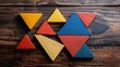 © TheWaterMeloonProjec - Tangram puzzle on wood table top view with space Early childhood development concept