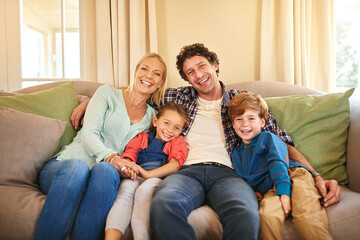 Wall Mural - Sharing a love that warms the heart. Portrait of a happy family spending quality time together at home.