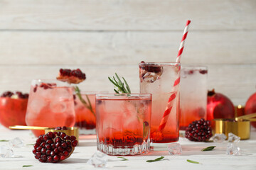 Wall Mural - Red cocktail with fresh pomegranate on a white background