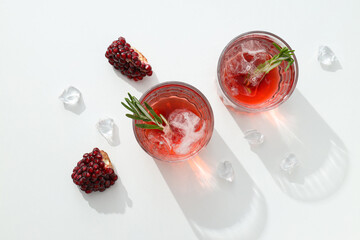 Wall Mural - Cocktail with fresh pomegranate on a white background