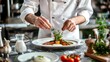 © Spectrum - A chef carefully plating on a stylish ceramic plate, garnished with fresh herbs