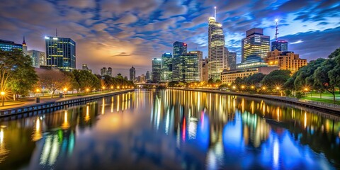 Sticker - A serene view of the river in Melbourne CBD at night, Melbourne, cityscape, skyline, buildings, reflections, lights