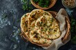 © LimeSky - Mint or garlic naan butter naan tandoori in a basket on table top view of Bangladeshi cuisine